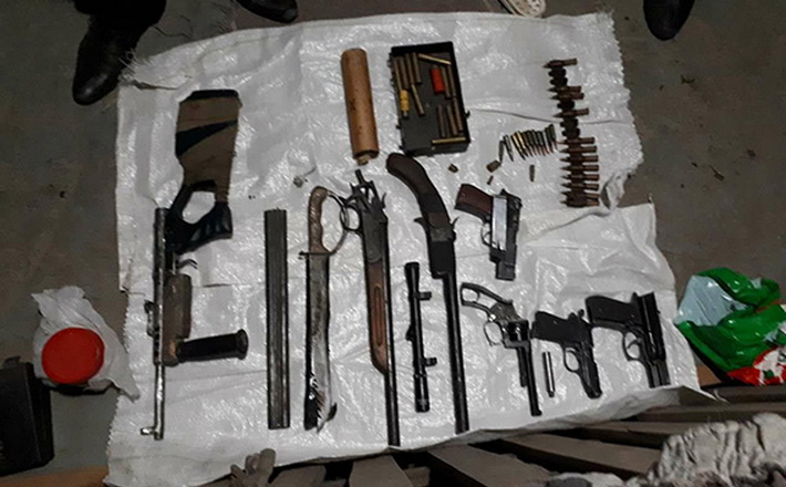 У жителя Христинівки поліцейські виявили зброю, набої та посів рослин коноплі